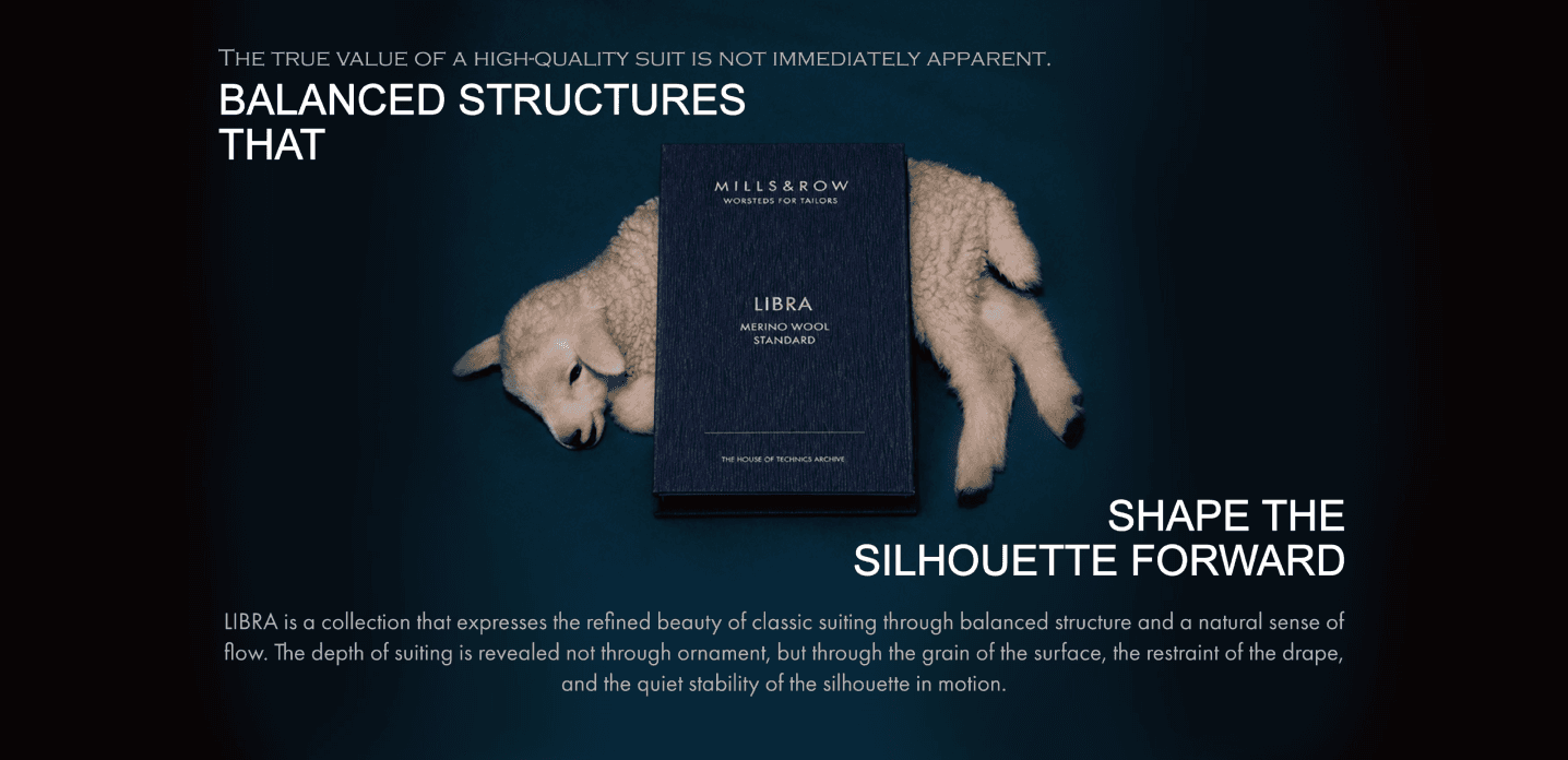 Libra 히어로 — 검정 배경에 조각상 손이 든 LIBRA 원단 책자. 헤드라인 "THE TRUE VALUE OF A HIGH-QUALITY SUIT IS NOT IMMEDIATELY APPARENT.", "BALANCED STRUCTURES THAT / SHAPE THE SILHOUETTE FORWARD" 가 이미지에 구워짐