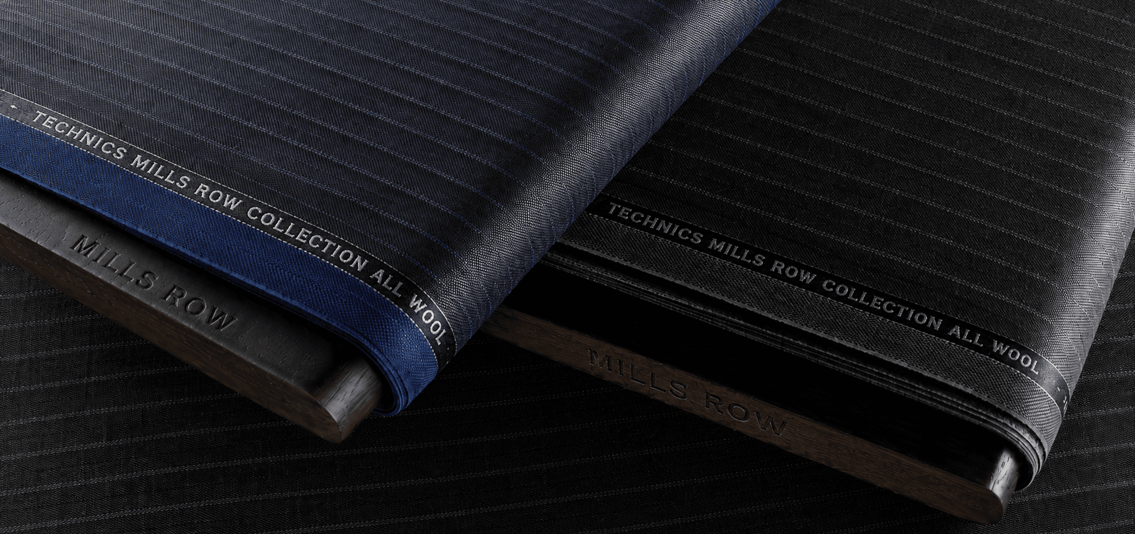 TECHNICS MILLS ROW 라벨이 붙은 남색·검정 원단 롤